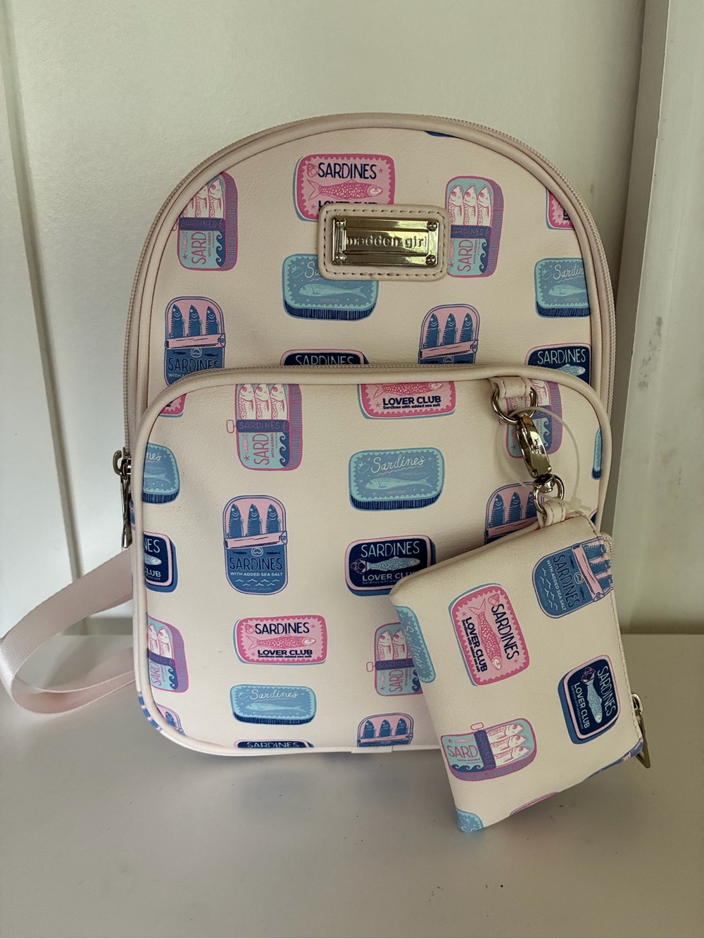 Madden Girl Cream Mini Backpack Bag with Pink and Blue Sardines Can Print